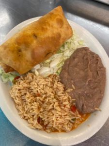 Chimichanga with rice and refried beans
